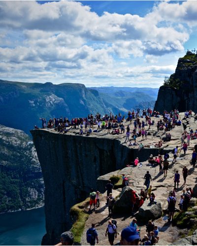 people-preikestolen-against-cloudy-sky-sunny-day
